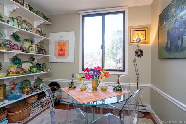 dining room featuring a baseboard heating unit