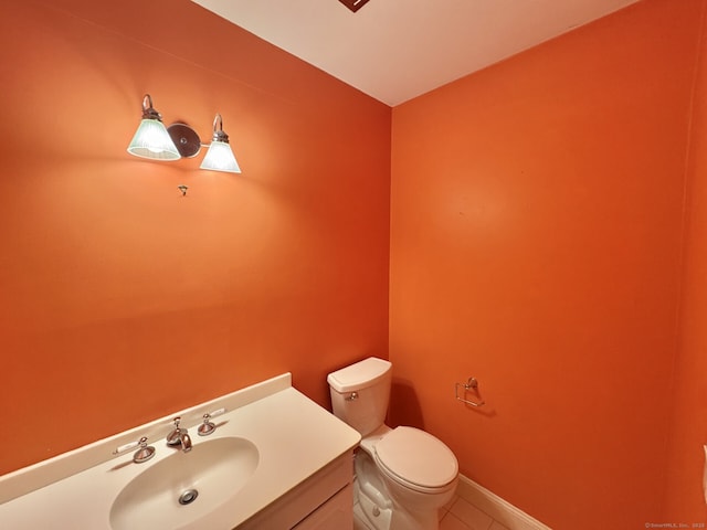 795 Prospect Ave Unit B-5, West Hartford, CT 06105 - bathroom featuring toilet, tile patterned flooring, vanity, and baseboards