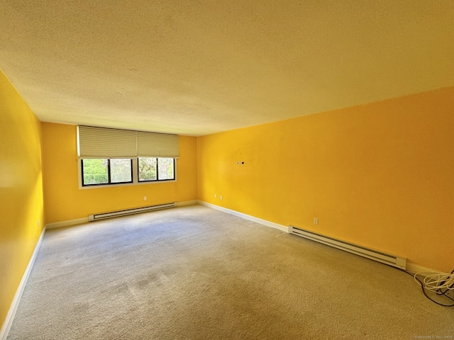 795 Prospect Ave Unit B-5, West Hartford, CT 06105 - carpeted empty room featuring a baseboard radiator, a textured ceiling, and baseboards