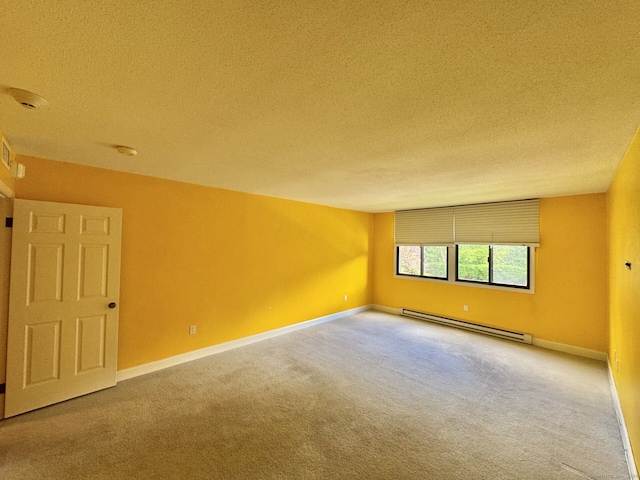 795 Prospect Ave Unit B-5, West Hartford, CT 06105 - spare room with baseboard heating, a textured ceiling, carpet floors, baseboards, and a smoke detector