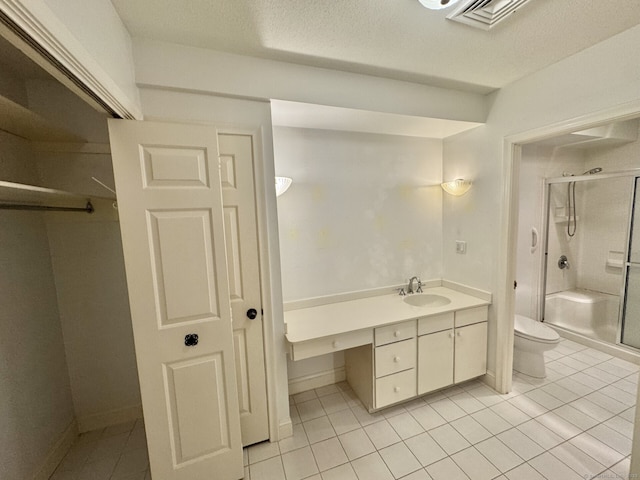 795 Prospect Ave Unit B-5, West Hartford, CT 06105 - bathroom featuring a stall shower, toilet, vanity, tile patterned flooring, and a textured ceiling