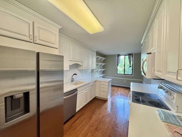 795 Prospect Ave Unit B-5, West Hartford, CT 06105 - kitchen with appliances with stainless steel finishes, dark wood-style flooring, a peninsula, light countertops, and open shelves