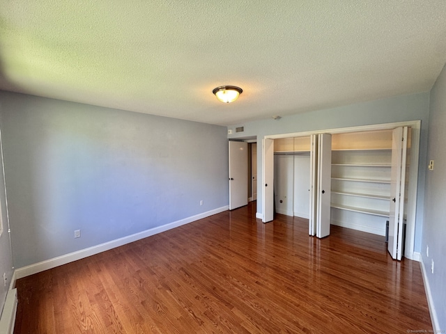 795 Prospect Ave Unit B-5, West Hartford, CT 06105 - unfurnished bedroom with wood finished floors, a textured ceiling, and baseboards