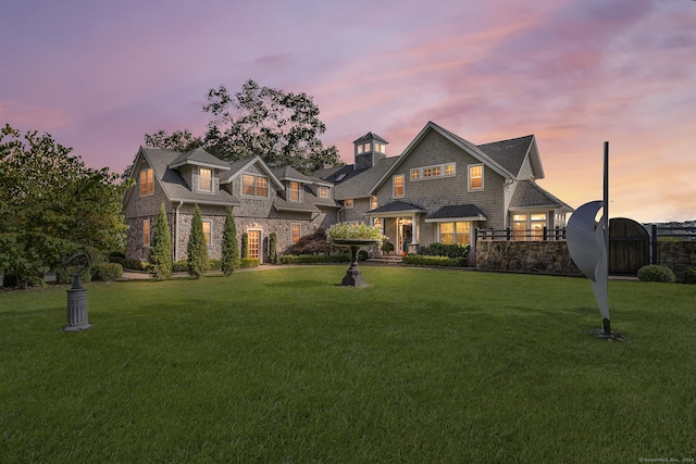 view of front of home with a lawn