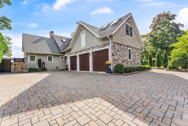 view of side of property featuring a garage