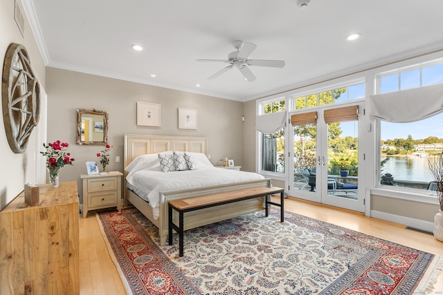 bedroom with access to exterior, ceiling fan, crown molding, a water view, and light hardwood / wood-style floors