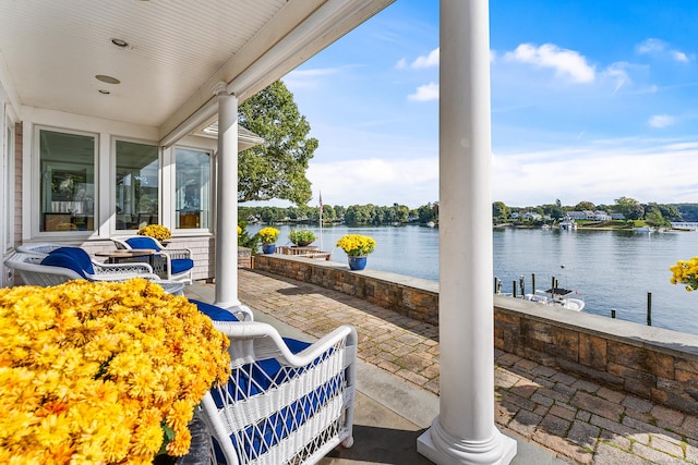 view of patio featuring a water view