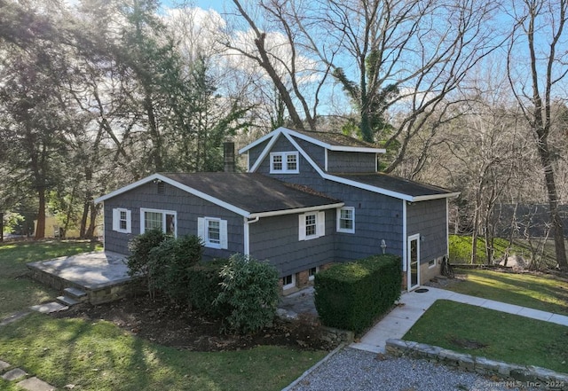 view of side of property with a lawn