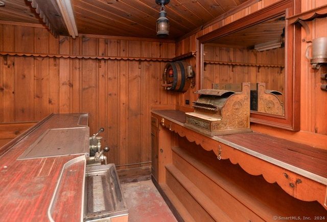 interior space featuring wood walls and wooden ceiling