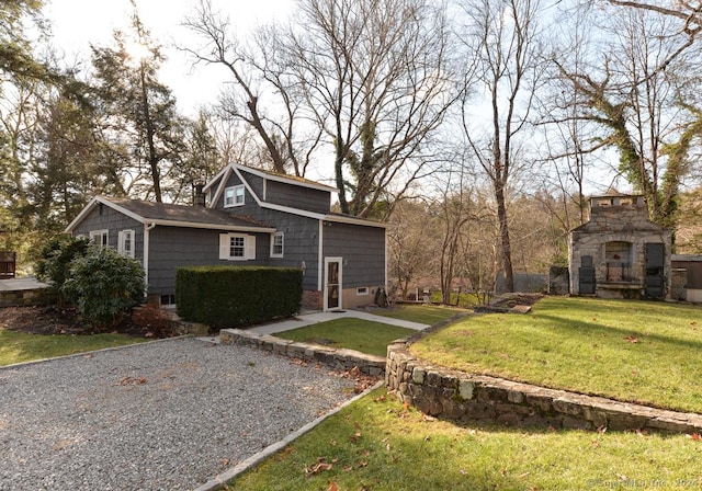 exterior space featuring an outdoor stone fireplace