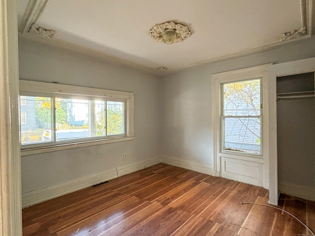 interior space featuring hardwood / wood-style flooring and a healthy amount of sunlight