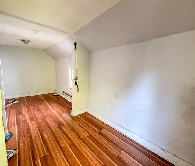 bonus room with hardwood / wood-style flooring, a baseboard radiator, and lofted ceiling