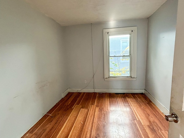 spare room featuring light wood-type flooring