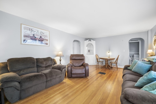 living room with light hardwood / wood-style flooring