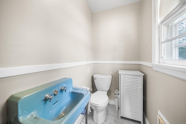 bathroom featuring sink and toilet