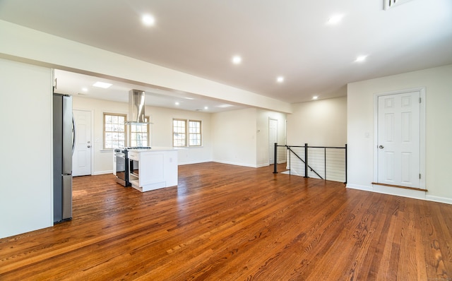 unfurnished living room with dark hardwood / wood-style floors