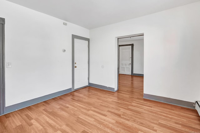 spare room with light wood-type flooring