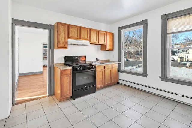 kitchen featuring light hardwood / wood-style flooring, black range with gas cooktop, a baseboard radiator, and sink