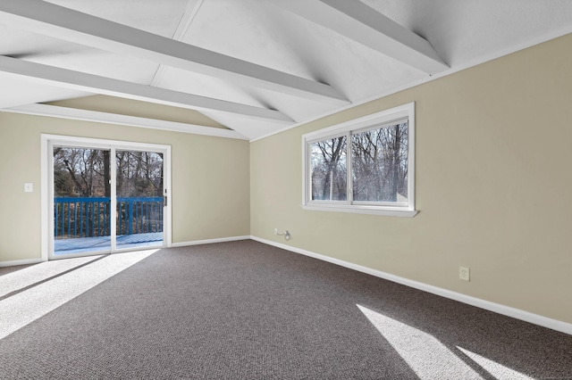 carpeted empty room featuring vaulted ceiling with beams