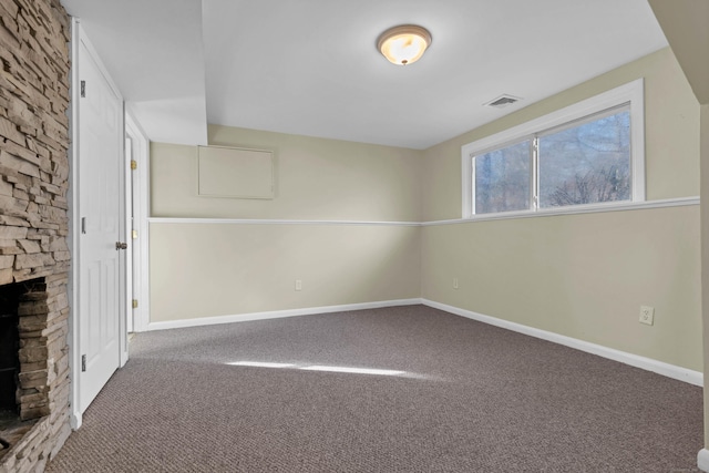 interior space with a stone fireplace