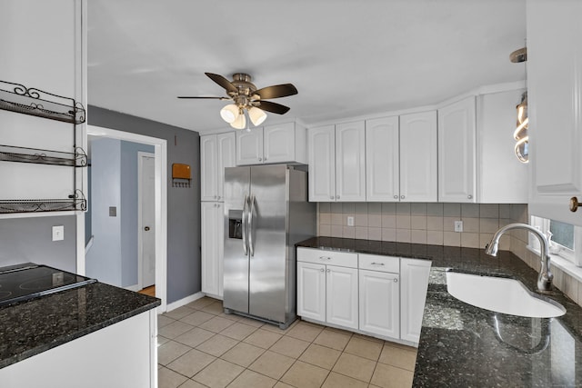 kitchen featuring white cabinets, sink, stainless steel refrigerator with ice dispenser, ceiling fan, and tasteful backsplash