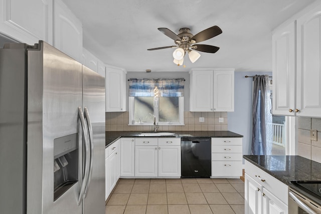 kitchen featuring ceiling fan, sink, decorative backsplash, white cabinets, and appliances with stainless steel finishes