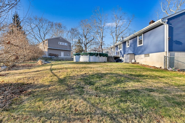 view of yard featuring a swimming pool side deck