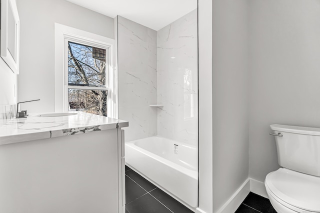 bathroom featuring tile patterned flooring, vanity, and toilet