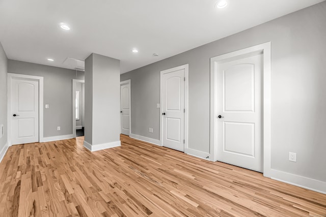 unfurnished bedroom with light wood-type flooring