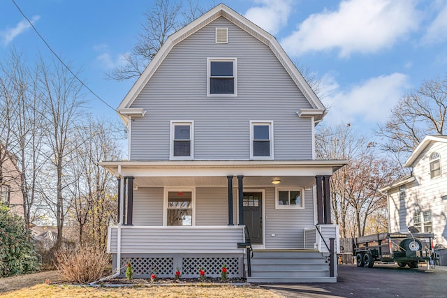 view of front property featuring covered porch