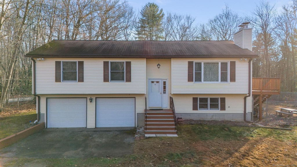 split foyer home featuring a garage