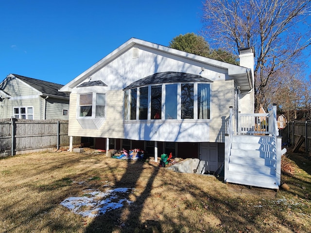 back of property featuring a yard