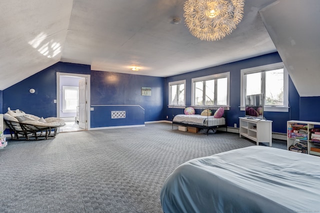 bedroom featuring carpet flooring, multiple windows, vaulted ceiling, and a baseboard heating unit