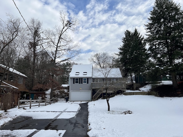 exterior space featuring a garage and a deck