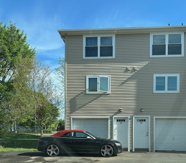 1259 E St Unit A, New Britain, CT 06053 - view of home's exterior with a garage