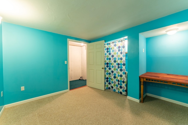 interior space featuring light carpet