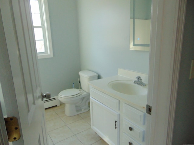 bathroom with tile patterned floors, vanity, a baseboard radiator, and toilet