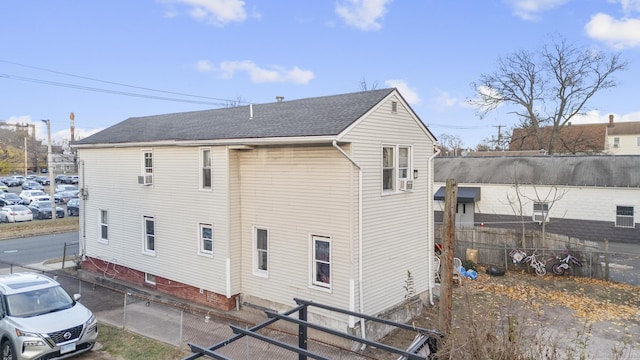 back of house with cooling unit