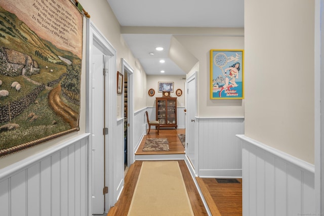 corridor featuring hardwood / wood-style floors