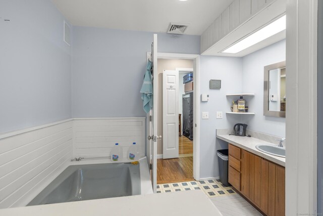 bathroom with vanity and wood-type flooring