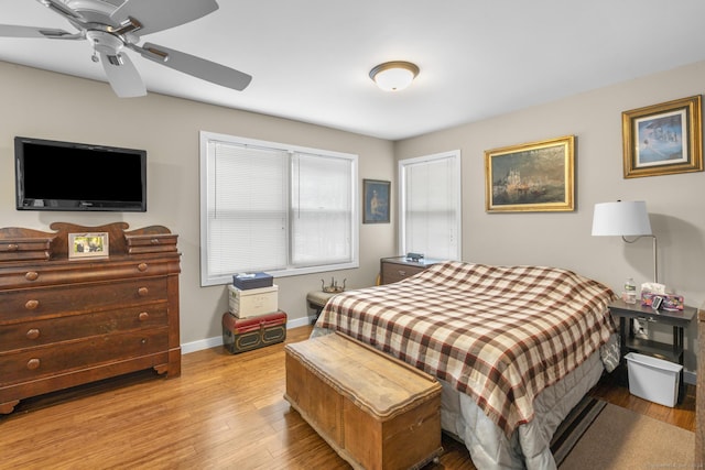 bedroom with ceiling fan and light hardwood / wood-style flooring