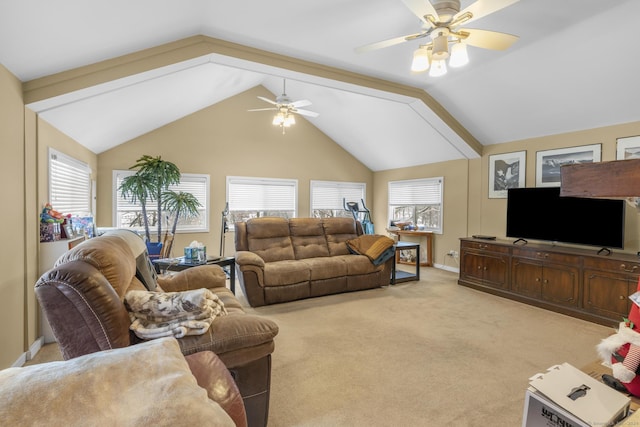 carpeted living room with ceiling fan, a healthy amount of sunlight, and lofted ceiling