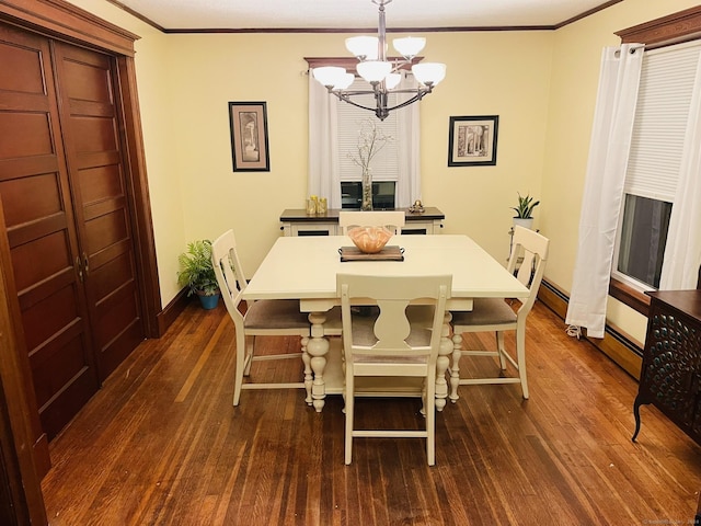 dining area featuring a notable chandelier, dark hardwood / wood-style floors, and crown molding