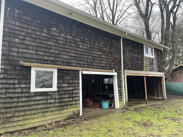 view of side of home with an outbuilding