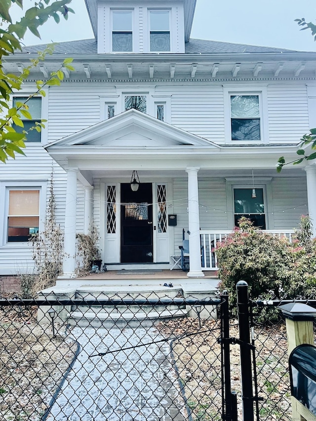 view of exterior entry featuring a porch