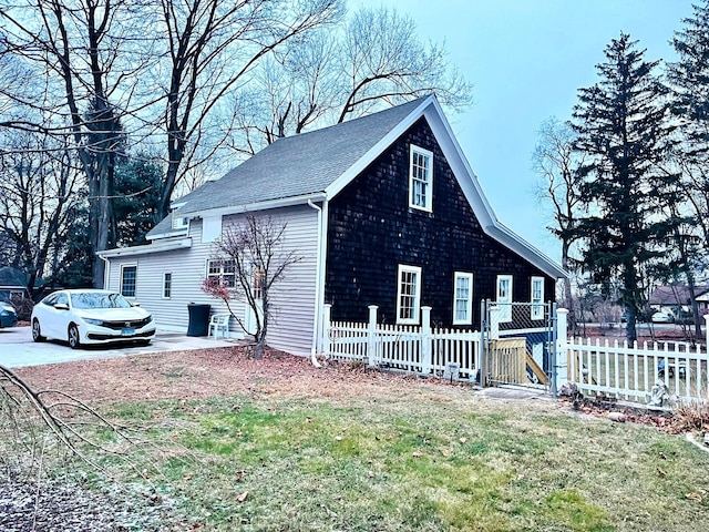 view of property exterior with a yard