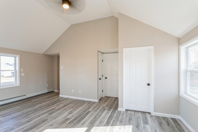 bonus room featuring ceiling fan, plenty of natural light, lofted ceiling, and light hardwood / wood-style flooring