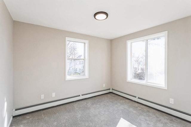 carpeted spare room with baseboard heating