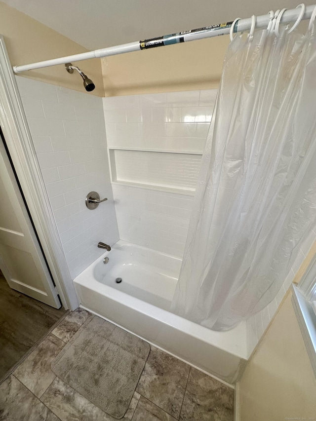 bathroom with tile patterned flooring and shower / bath combo with shower curtain