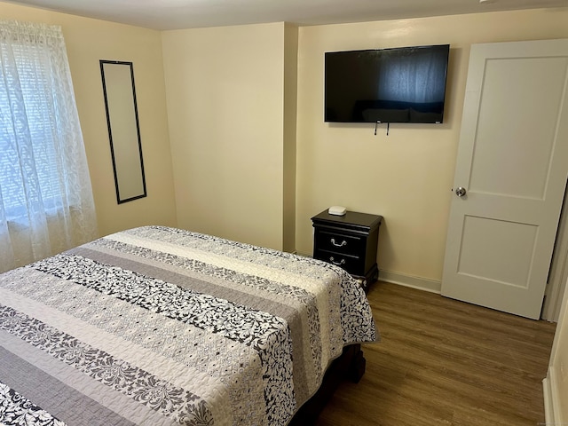 bedroom with hardwood / wood-style flooring